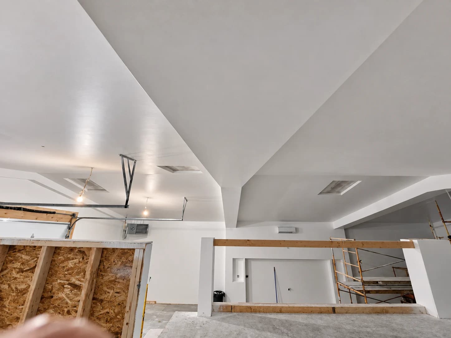 Smooth finished drywall around an angled ceiling and soffit